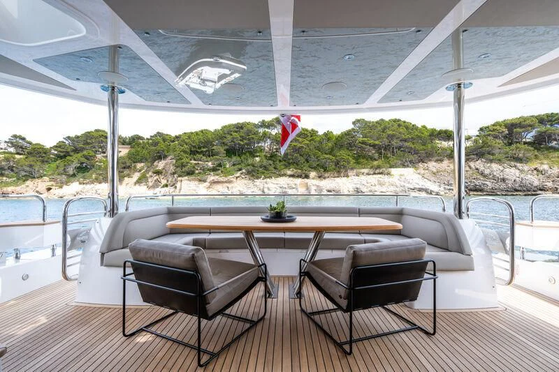 a table and chairs in a room aboard BLUE INFINITY ONE Yacht for Sale