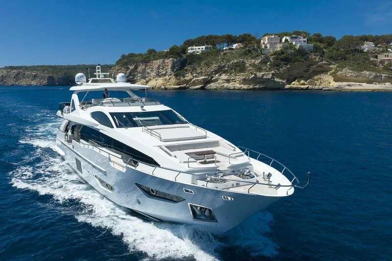 a white yacht on the water aboard MR. X Yacht for Sale