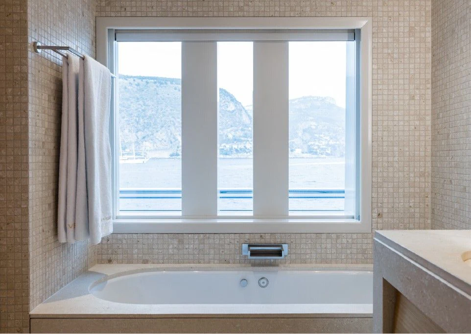 a bathroom with a large window aboard VENTUM MARIS Yacht for Charter