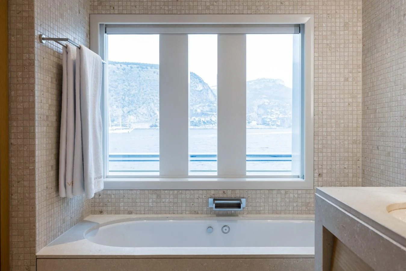 a bathroom with a large window aboard VENTUM MARIS Yacht for Charter