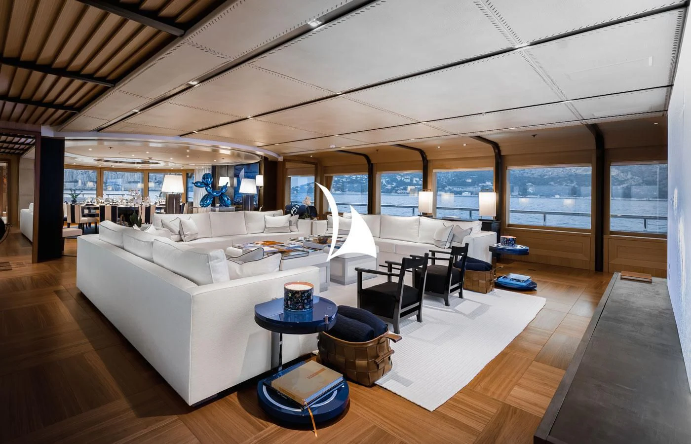 a room with a couch and a table aboard VENTUM MARIS Yacht for Charter