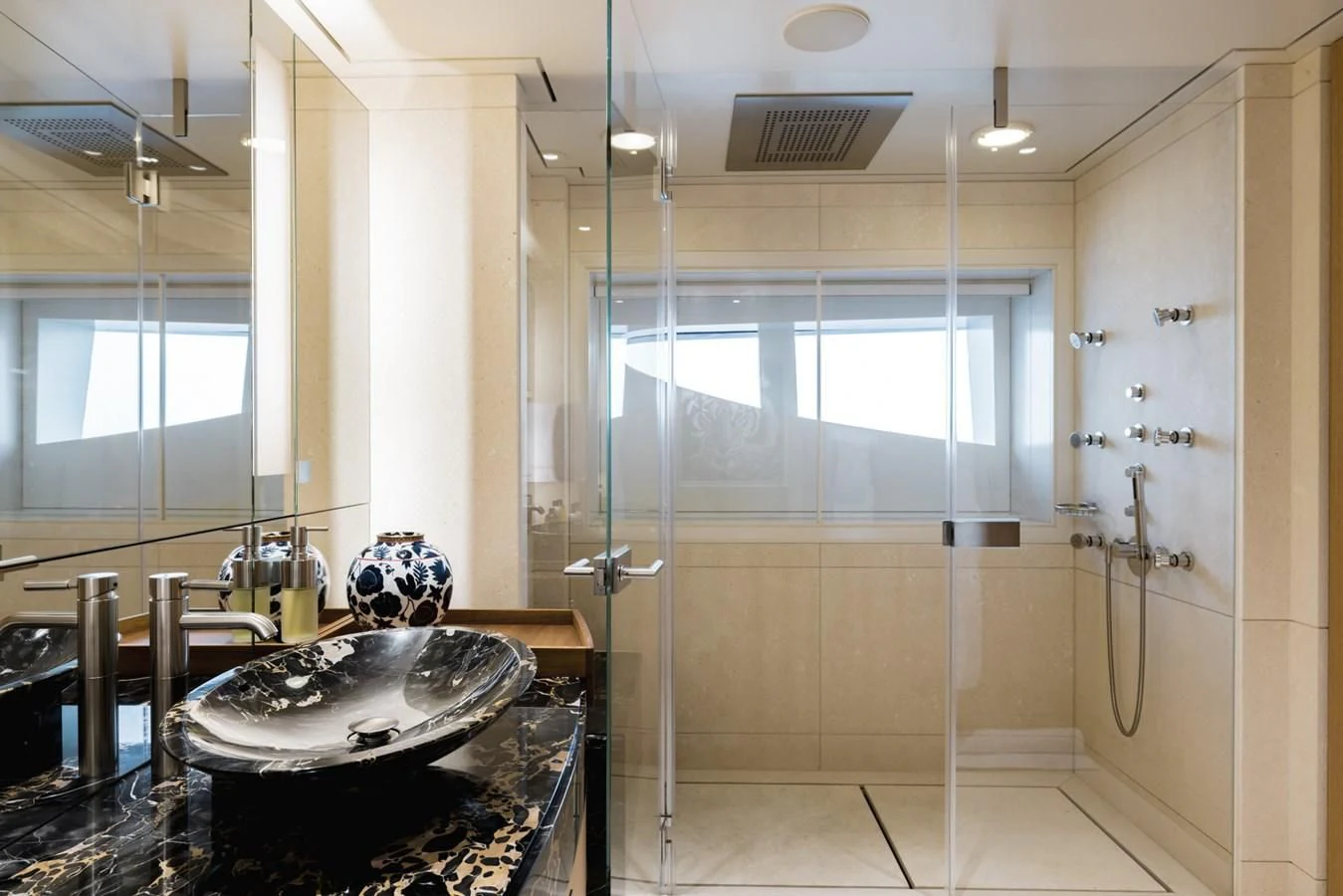 a bathroom with a sink and shower aboard VENTUM MARIS Yacht for Charter