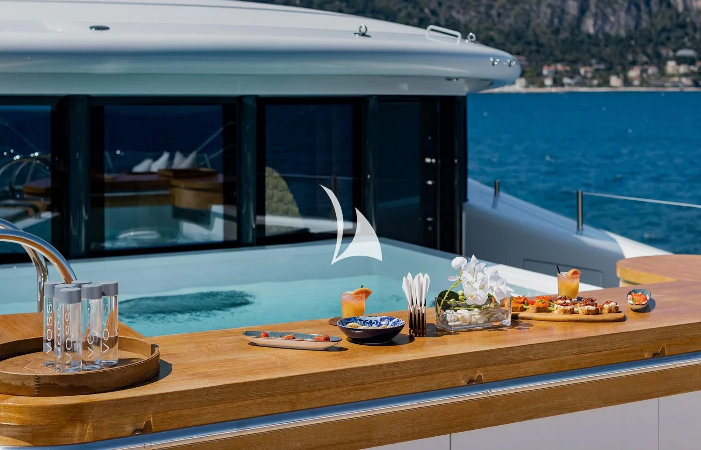 a table with food and drinks on it aboard VENTUM MARIS Yacht for Charter