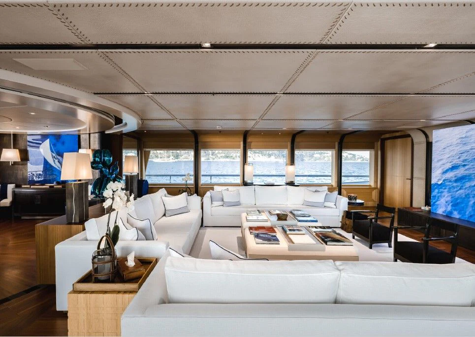 a large room with a couch and a tv aboard VENTUM MARIS Yacht for Charter