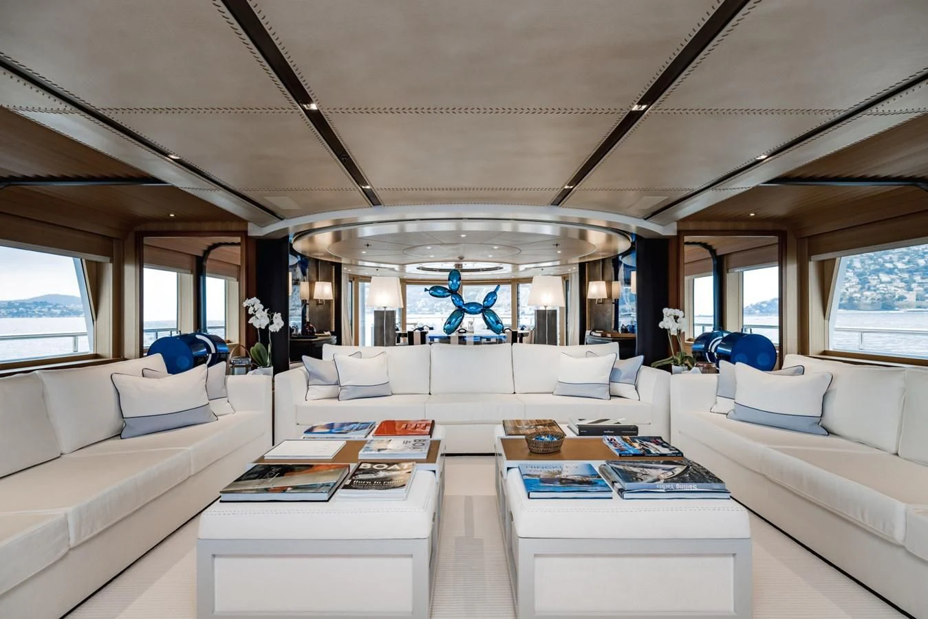 a white living room with a white couch and a blue star on the ceiling aboard VENTUM MARIS Yacht for Charter