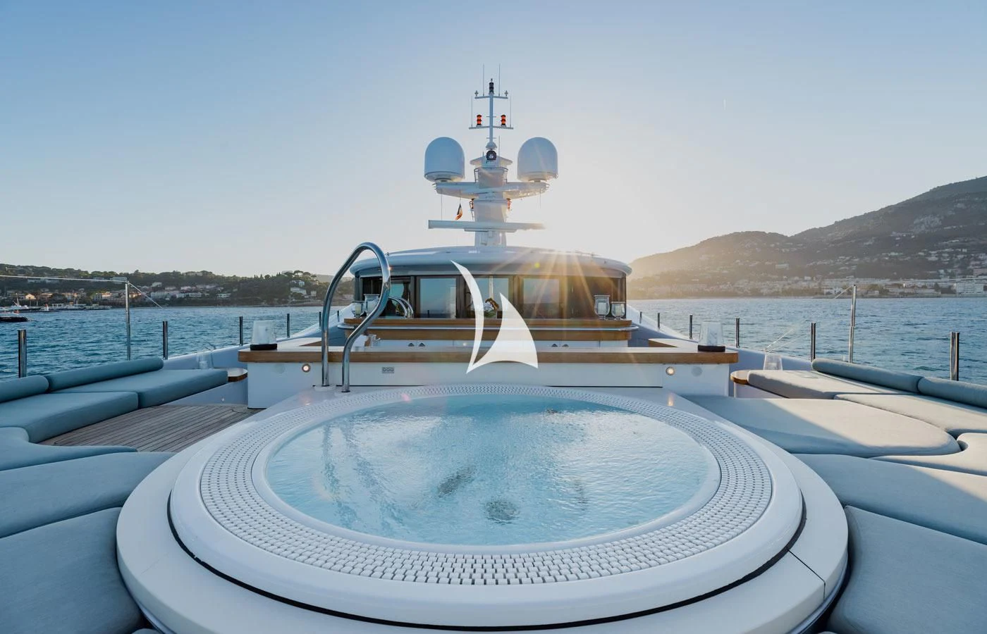 a large white boat on a body of water aboard VENTUM MARIS Yacht for Charter