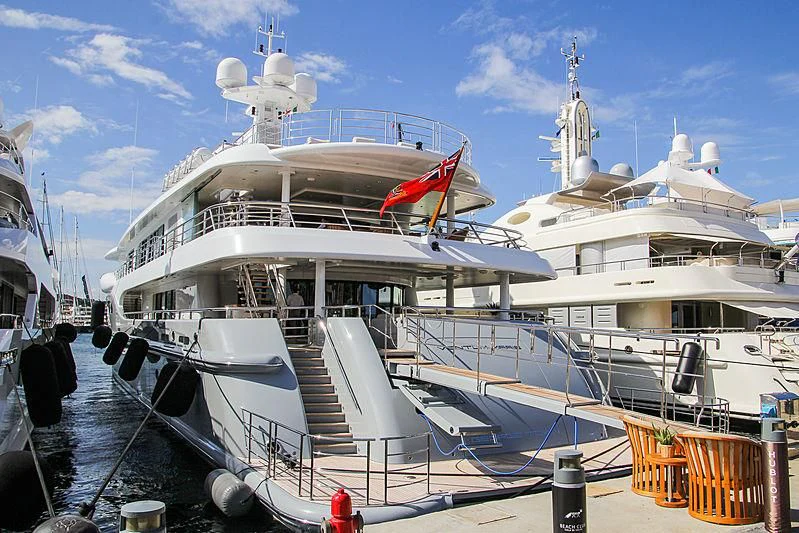 a large white boat with a red crane on the deck aboard VENTUM MARIS Yacht for Charter