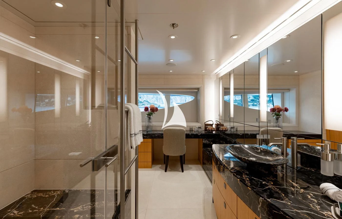 a large bathroom with glass walls aboard VENTUM MARIS Yacht for Charter