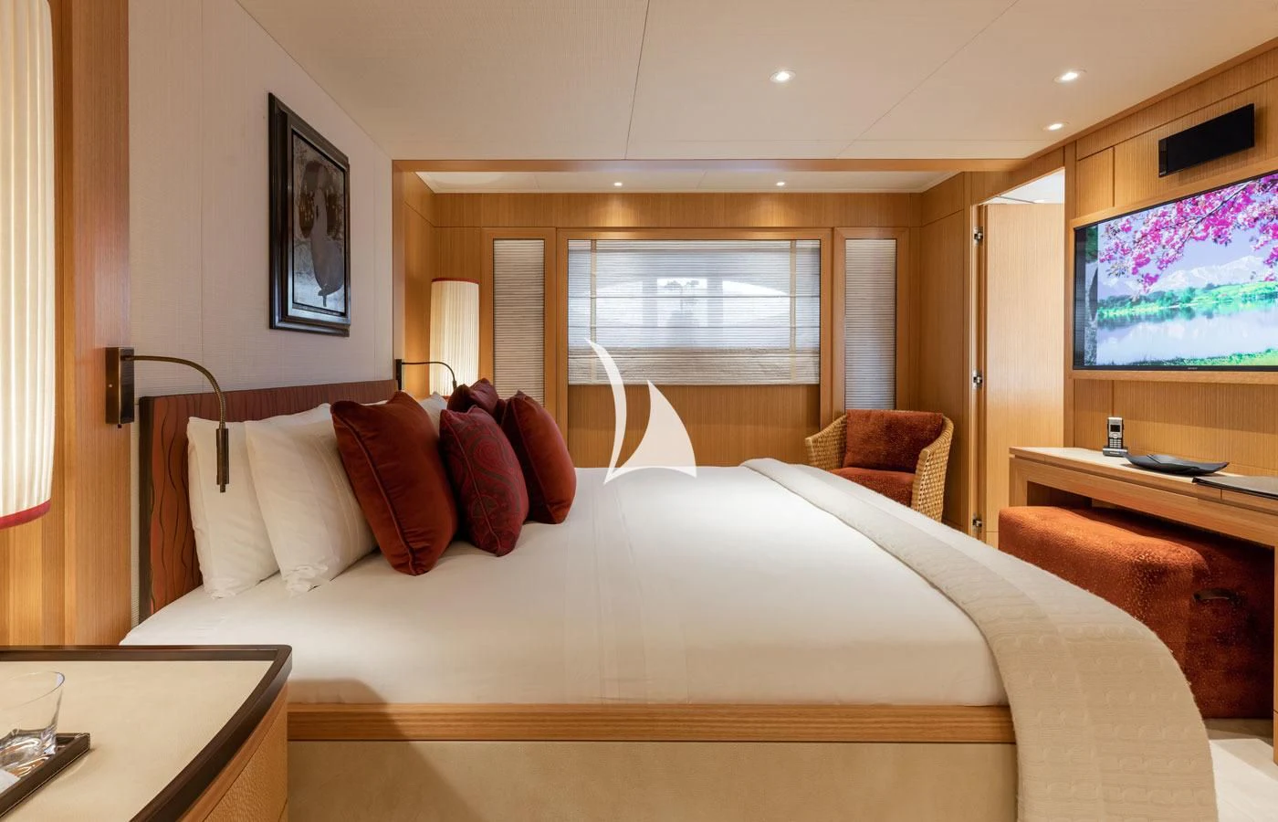 a hotel room with a bed and a tv aboard VENTUM MARIS Yacht for Charter