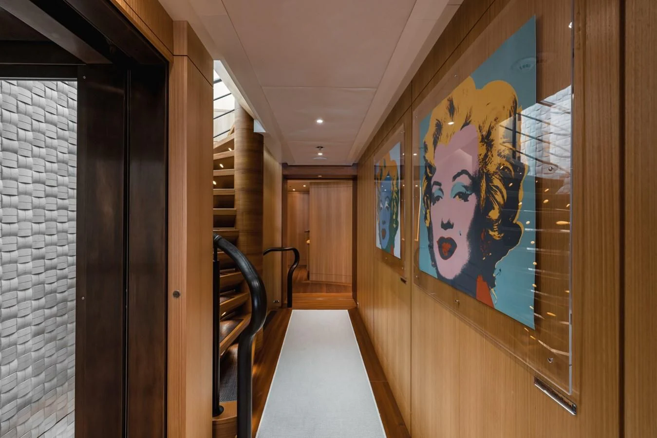 a hallway with a painting on the wall aboard VENTUM MARIS Yacht for Charter