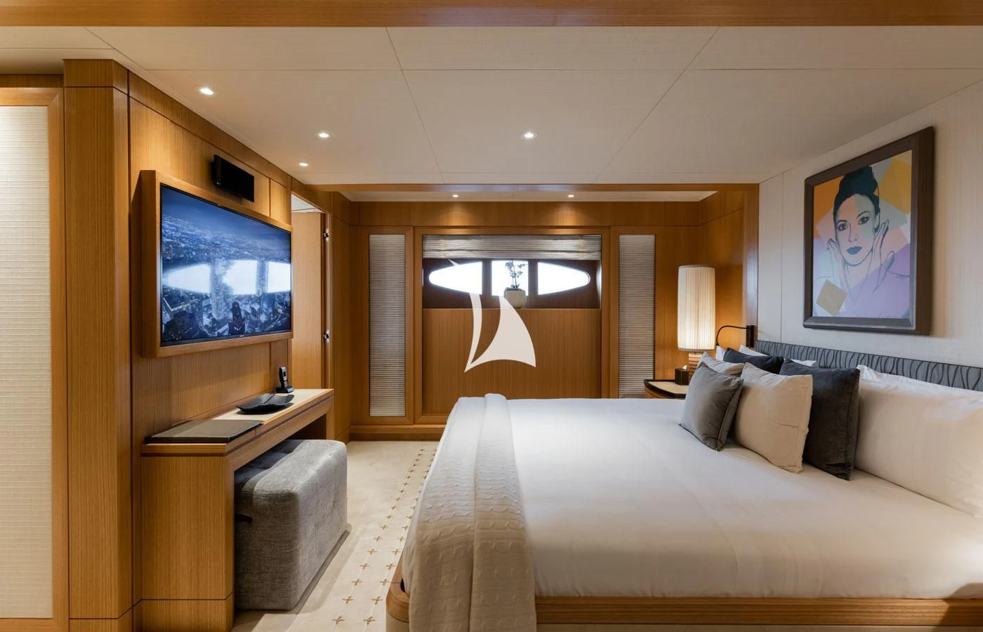 a hotel room with a bed and a tv aboard VENTUM MARIS Yacht for Charter