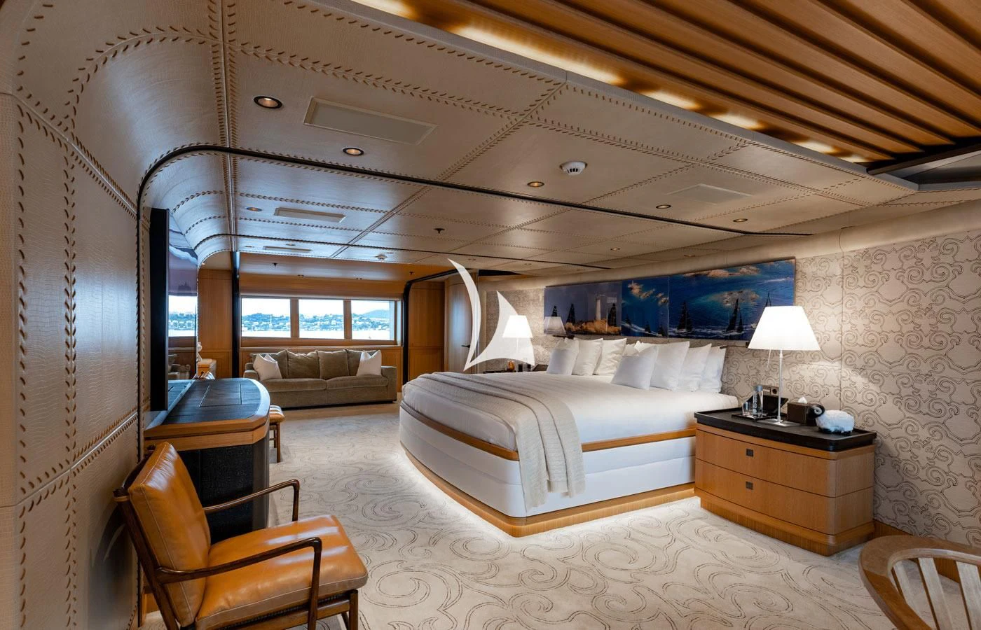 a large bedroom with a bed and a couch aboard VENTUM MARIS Yacht for Charter