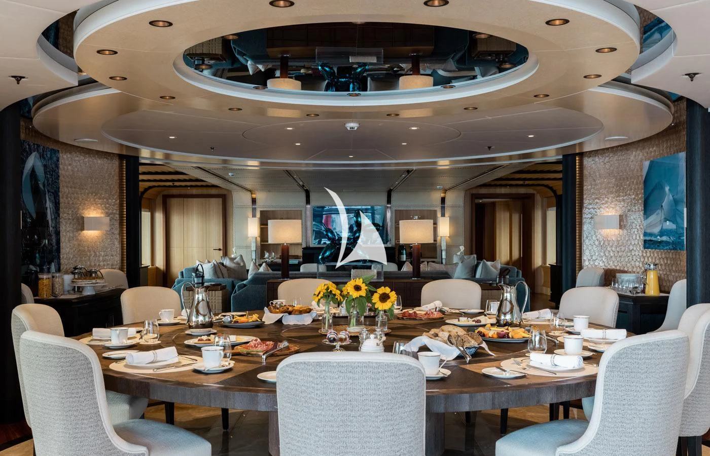 a large room with tables and chairs aboard VENTUM MARIS Yacht for Charter