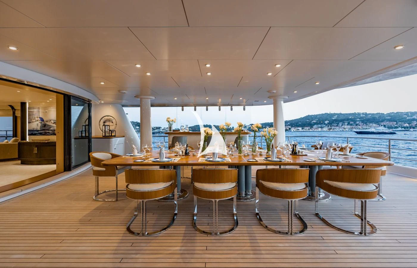 a restaurant with a view of the ocean and the ocean aboard VENTUM MARIS Yacht for Charter