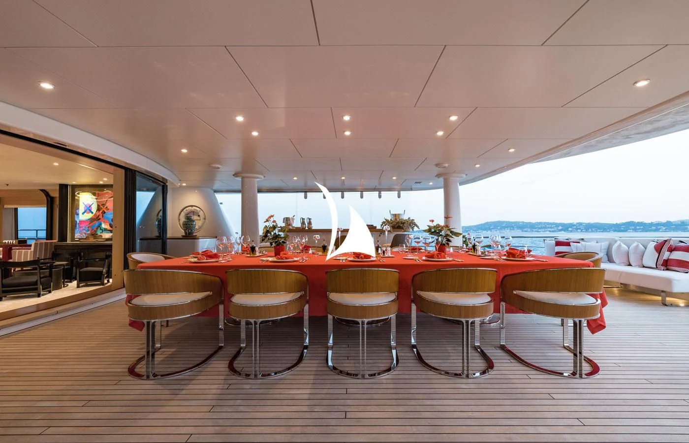 a room with tables and chairs aboard VENTUM MARIS Yacht for Charter