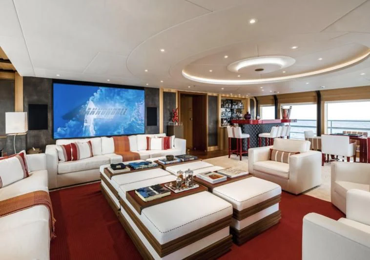 a living room with a large screen aboard VENTUM MARIS Yacht for Charter