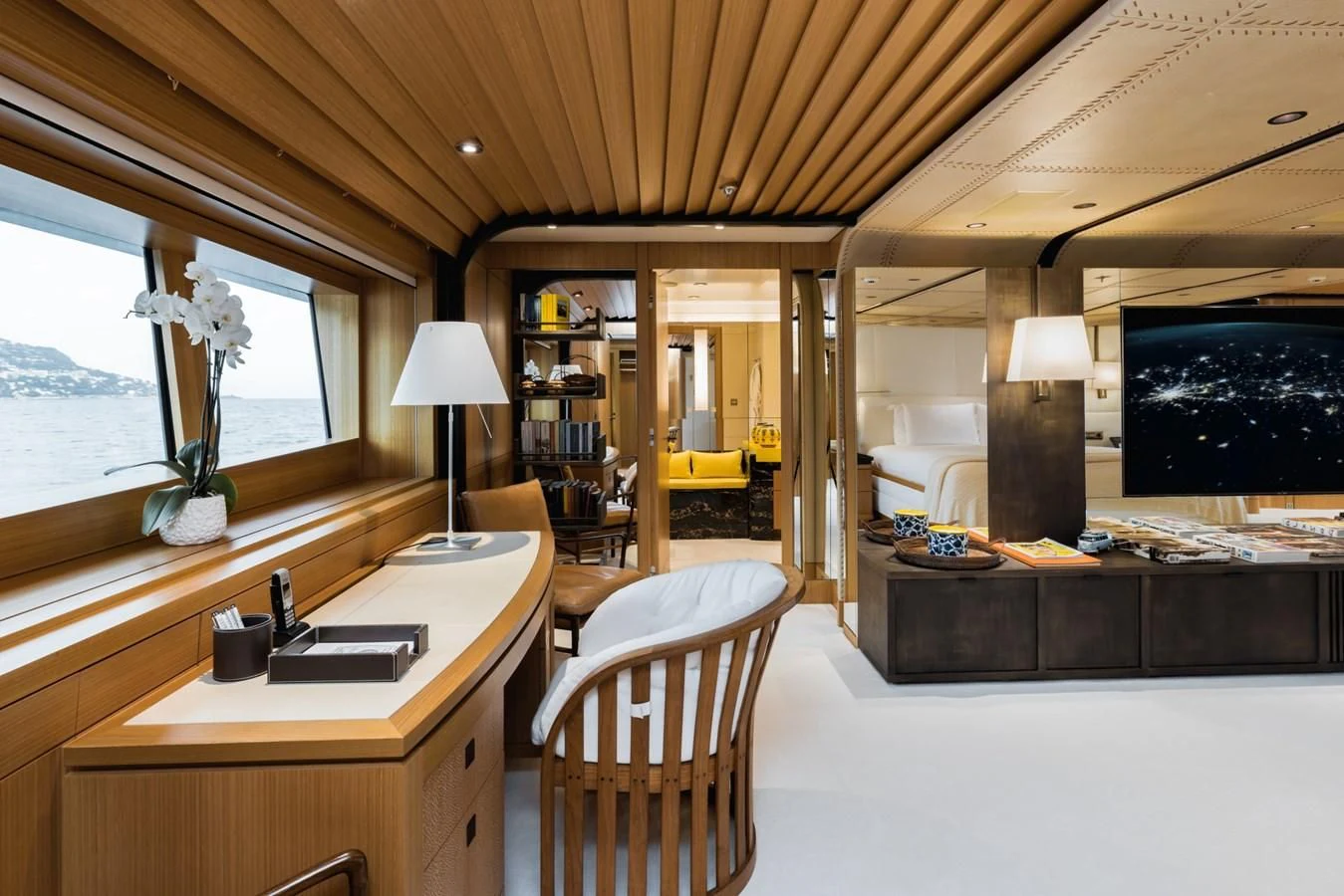 a room with a desk and a tv aboard VENTUM MARIS Yacht for Charter