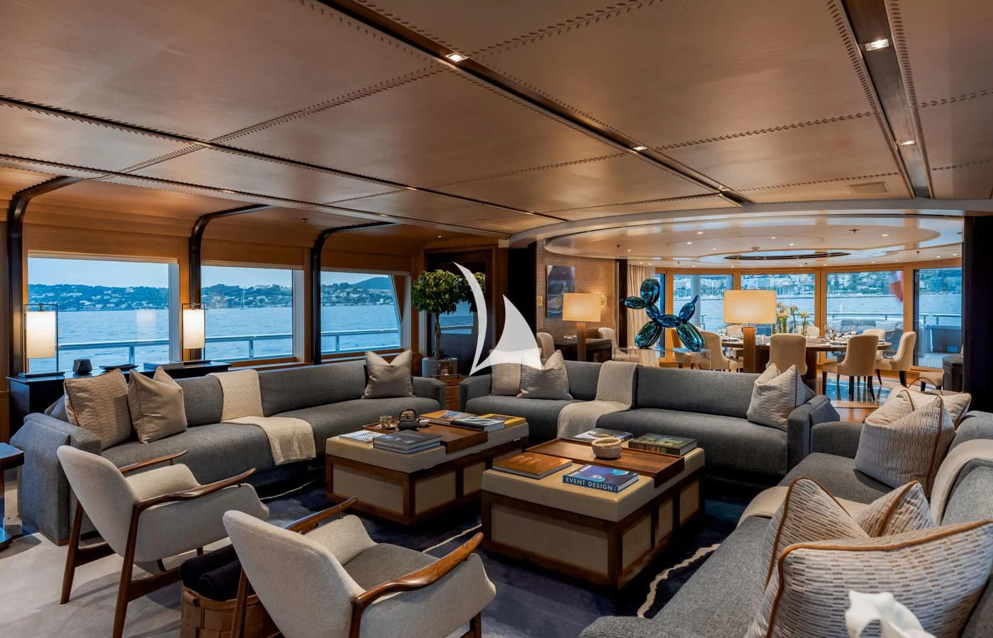 a living room with a large window aboard VENTUM MARIS Yacht for Charter