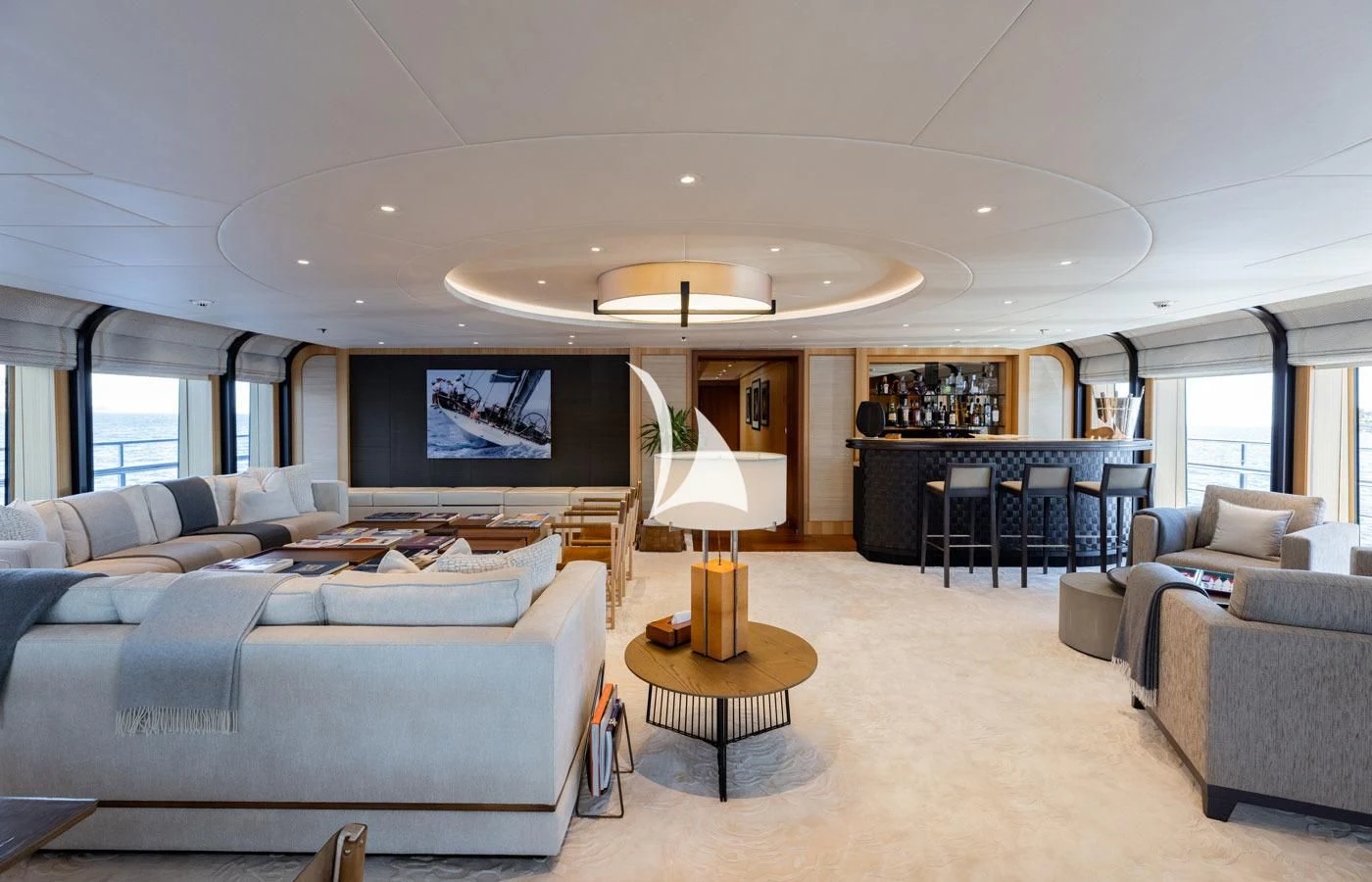 a living room with a large screen aboard VENTUM MARIS Yacht for Charter