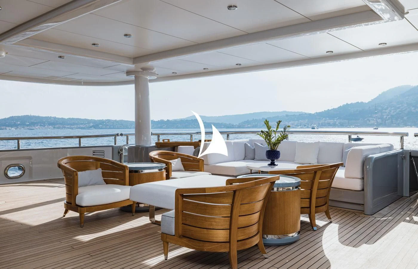 a room with a table chairs and a tv aboard VENTUM MARIS Yacht for Charter