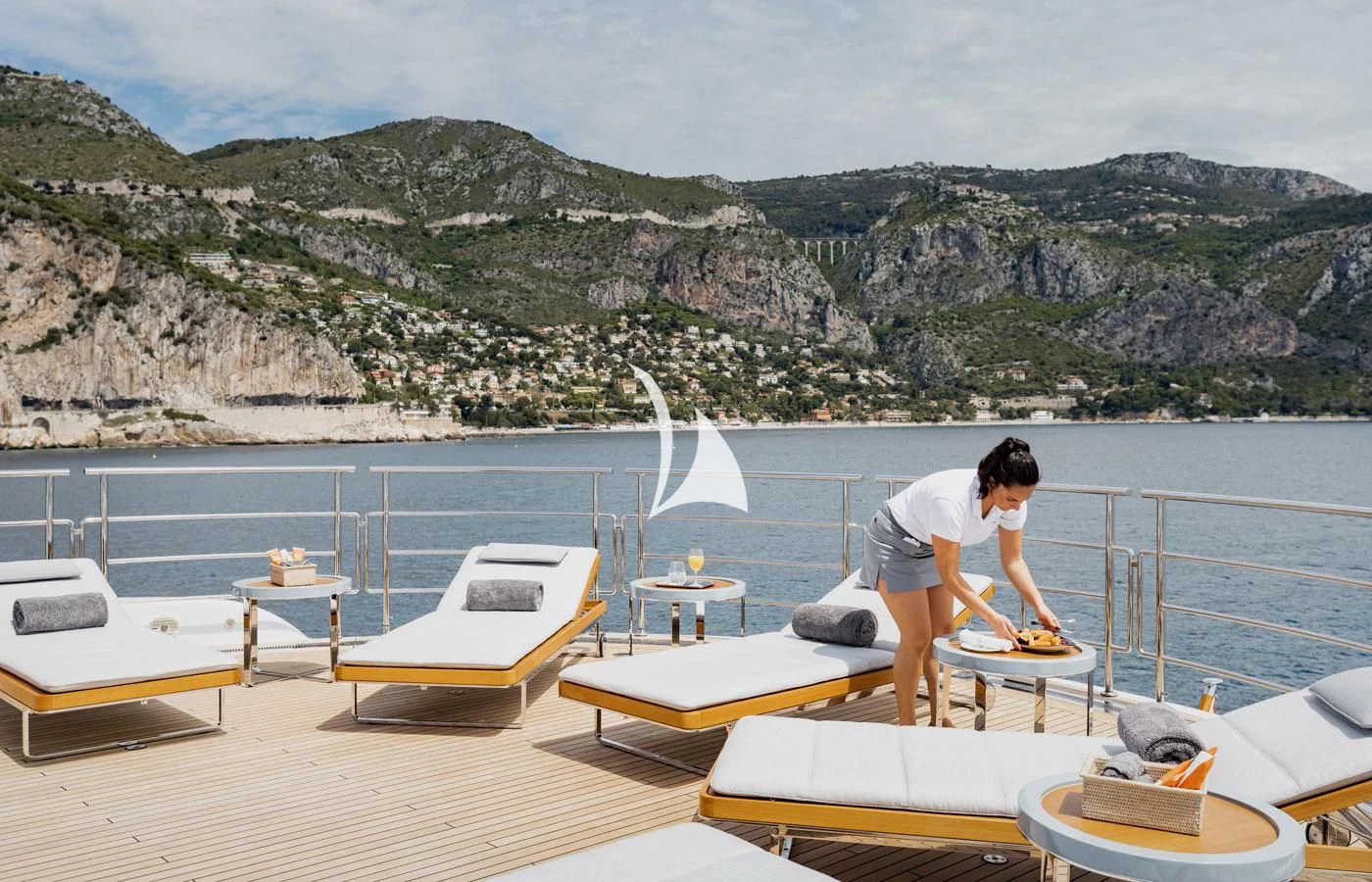 a person sitting on a dock aboard VENTUM MARIS Yacht for Charter