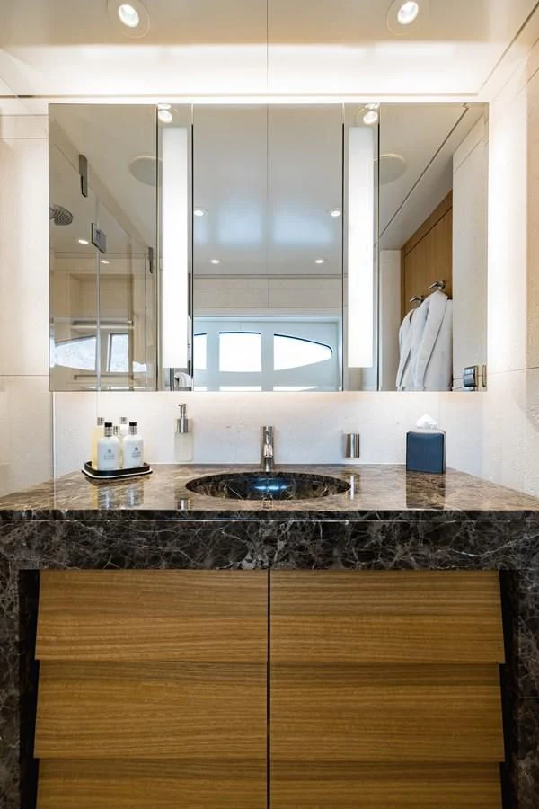a bathroom with a sink and a mirror aboard VENTUM MARIS Yacht for Charter