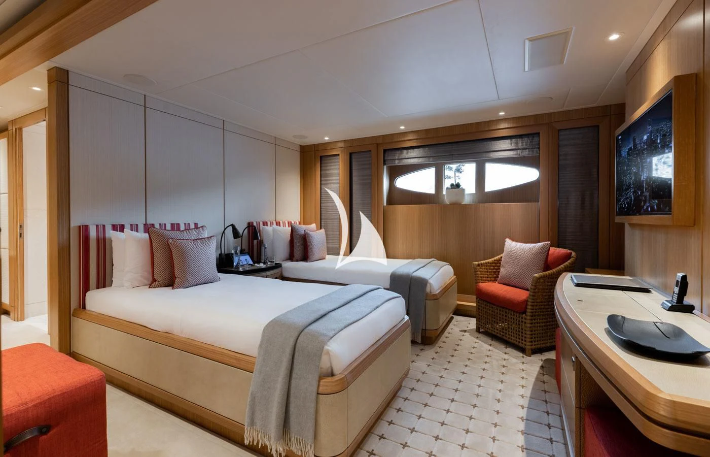 a hotel room with a bed and a chair aboard VENTUM MARIS Yacht for Charter