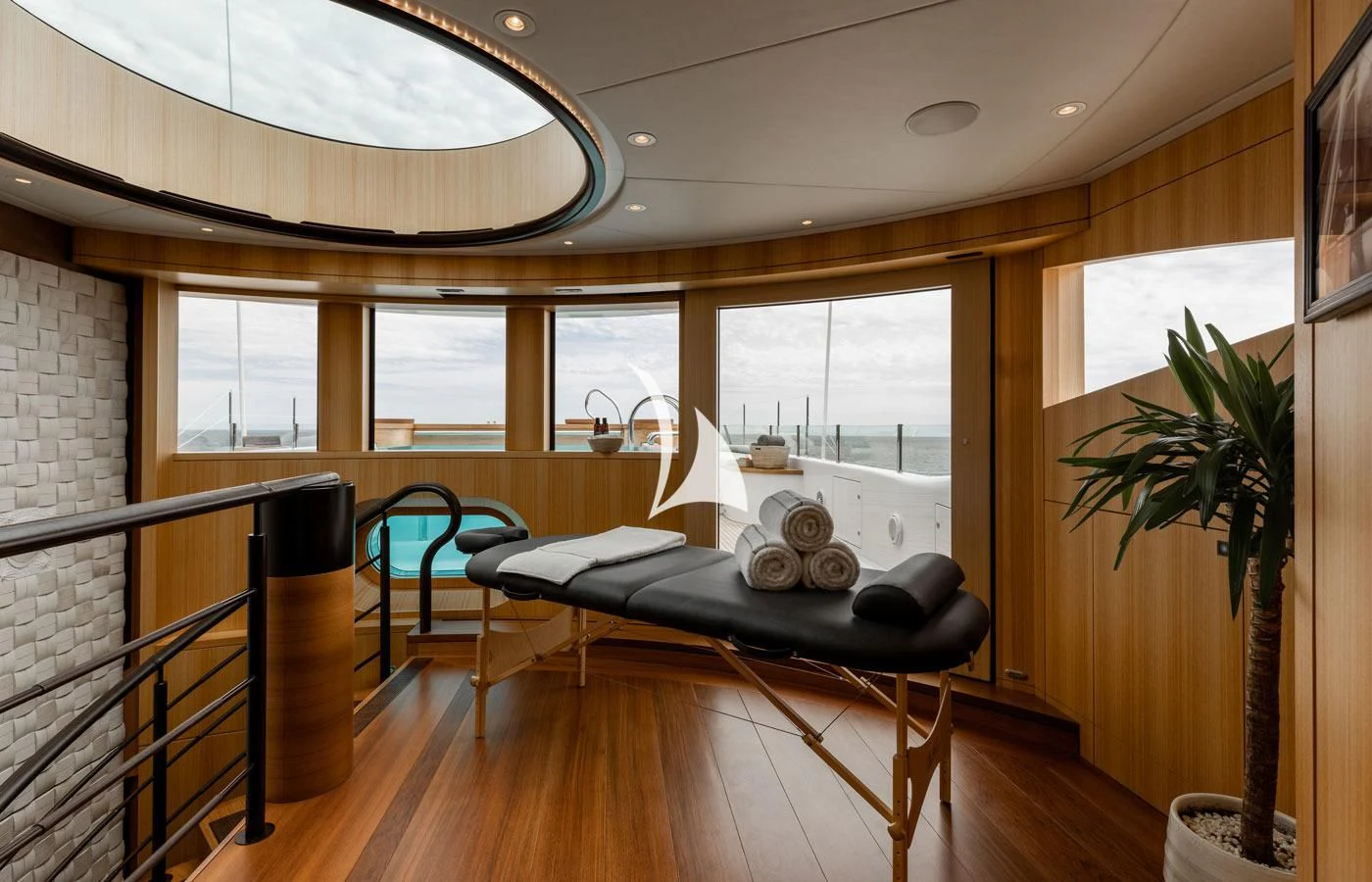a room with a bed and a table and chairs aboard VENTUM MARIS Yacht for Charter