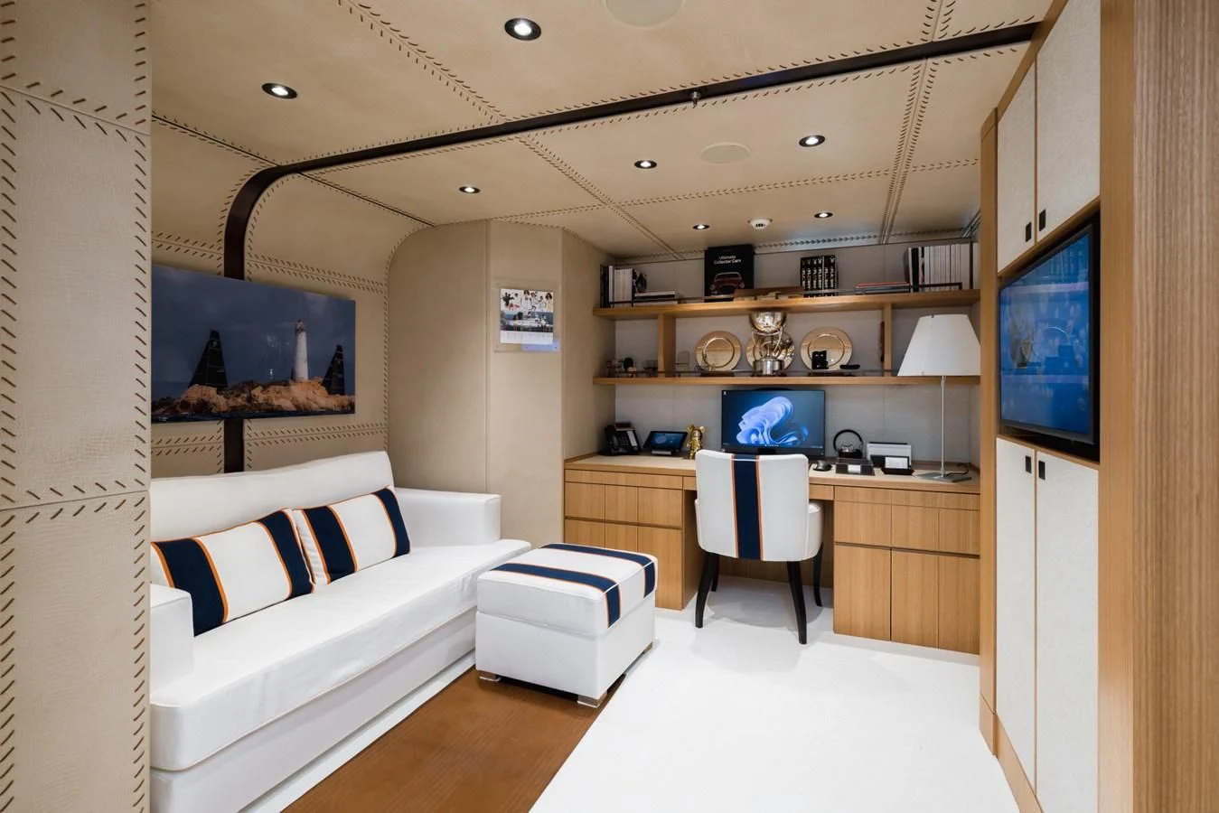 a room with a bed and a desk aboard VENTUM MARIS Yacht for Charter