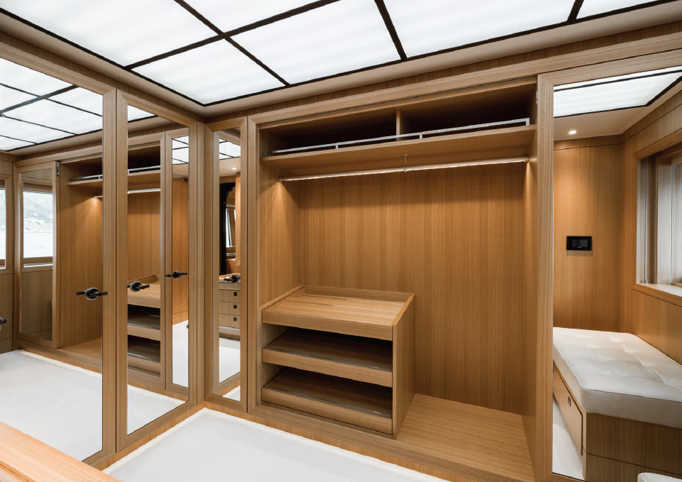 a room with a bed and a desk aboard VENTUM MARIS Yacht for Charter