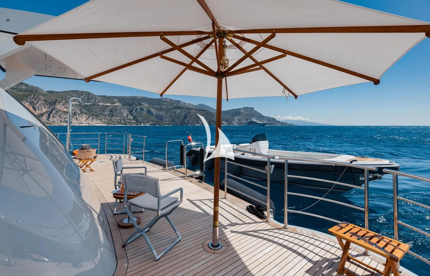 a deck with chairs and umbrellas on it aboard VENTUM MARIS Yacht for Charter