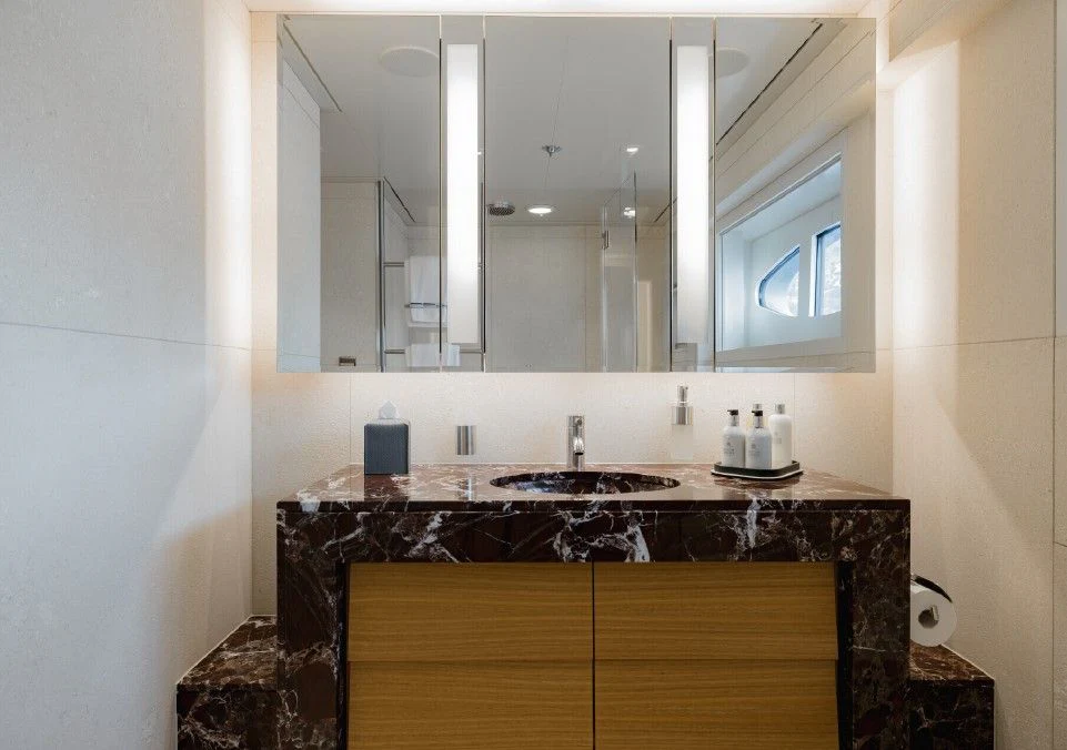 a bathroom with a large mirror aboard VENTUM MARIS Yacht for Charter