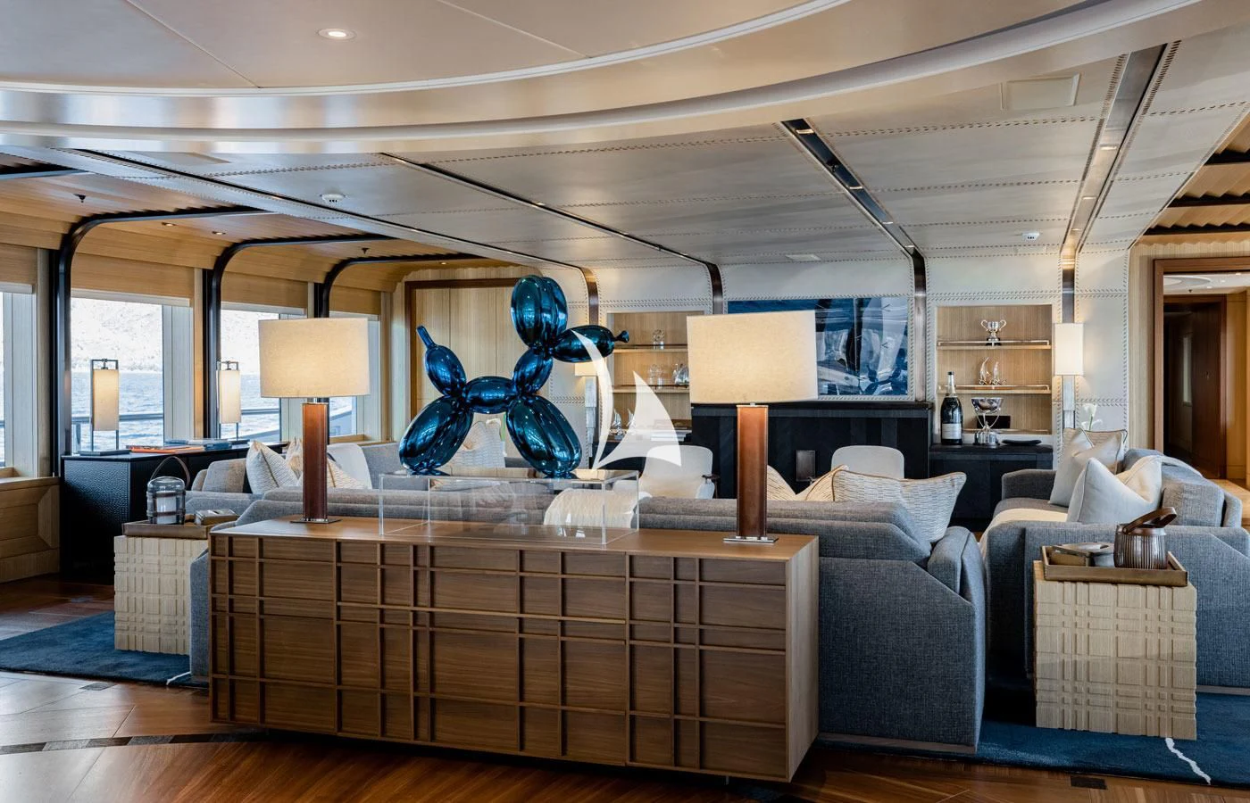a room with a large blue bear statue on the wall aboard VENTUM MARIS Yacht for Charter