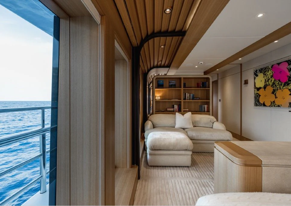 a living room with a large window aboard VENTUM MARIS Yacht for Charter