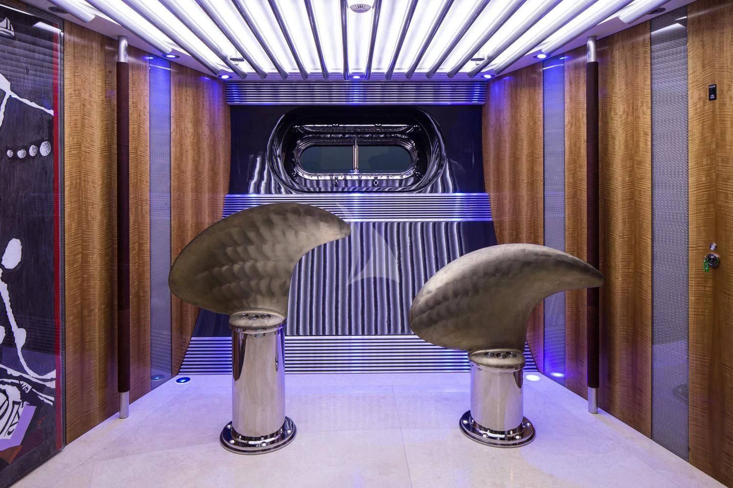 a couple of large glass vases with a couple of large round objects in front of them aboard MALTESE FALCON Yacht for Sale