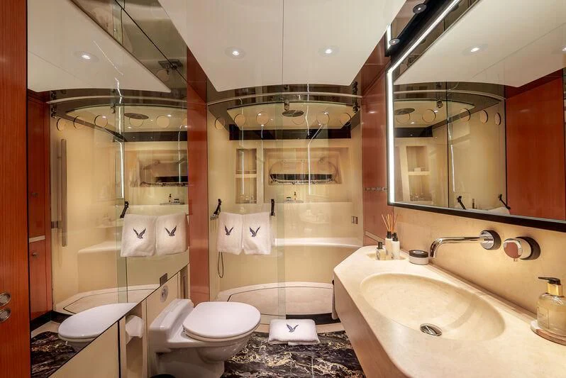 a bathroom with a large mirror aboard MALTESE FALCON Yacht for Sale
