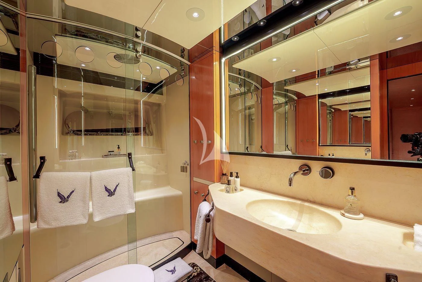 a bathroom with a large mirror aboard MALTESE FALCON Yacht for Sale