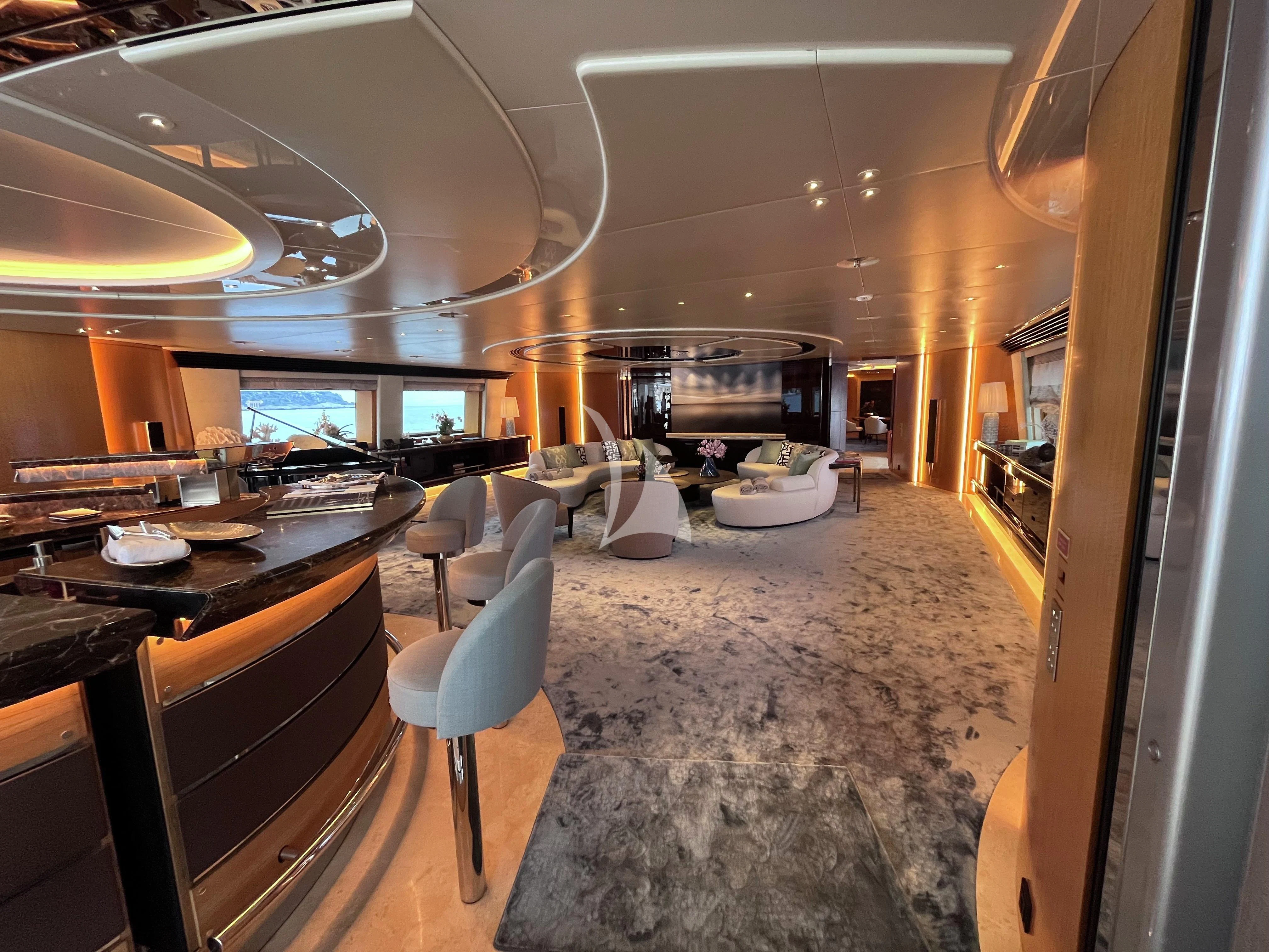 a room with a table and chairs aboard MALTESE FALCON Yacht for Sale