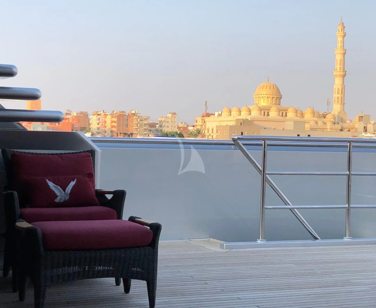 a couple of purple chairs overlooking a city aboard MALTESE FALCON Yacht for Sale