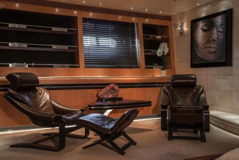 a room with a piano and a chair aboard MALTESE FALCON Yacht for Sale