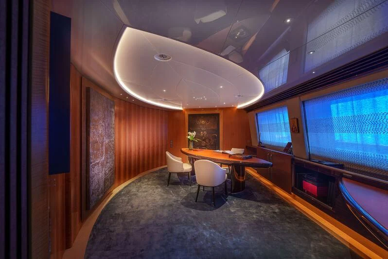 a room with a table and chairs aboard MALTESE FALCON Yacht for Sale