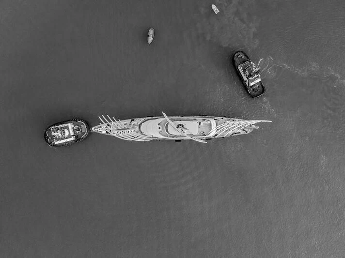 a pair of silver and black sneakers aboard MALTESE FALCON Yacht for Sale