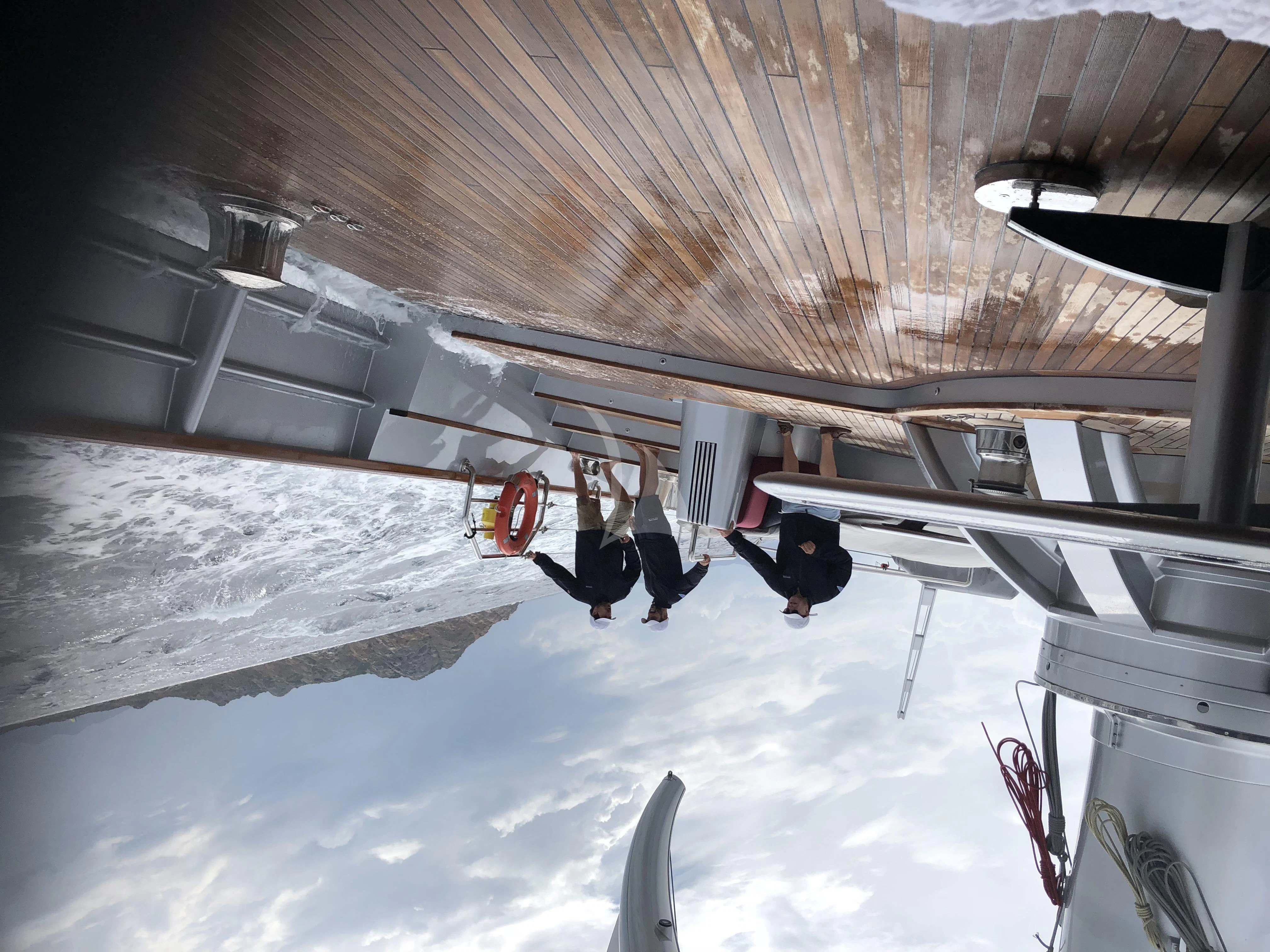 a person lying on the ground aboard MALTESE FALCON Yacht for Sale