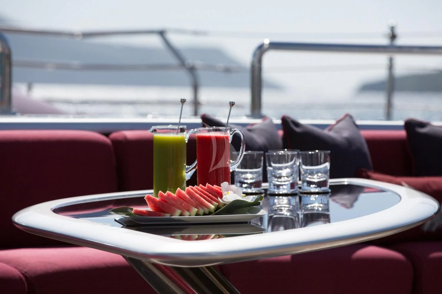 a table with food and drinks on it aboard MALTESE FALCON Yacht for Sale