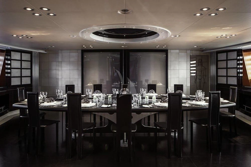 a large table with many glasses on it aboard MALTESE FALCON Yacht for Sale