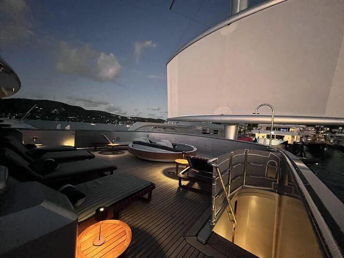 a deck with a deck and a boat on it aboard MALTESE FALCON Yacht for Sale