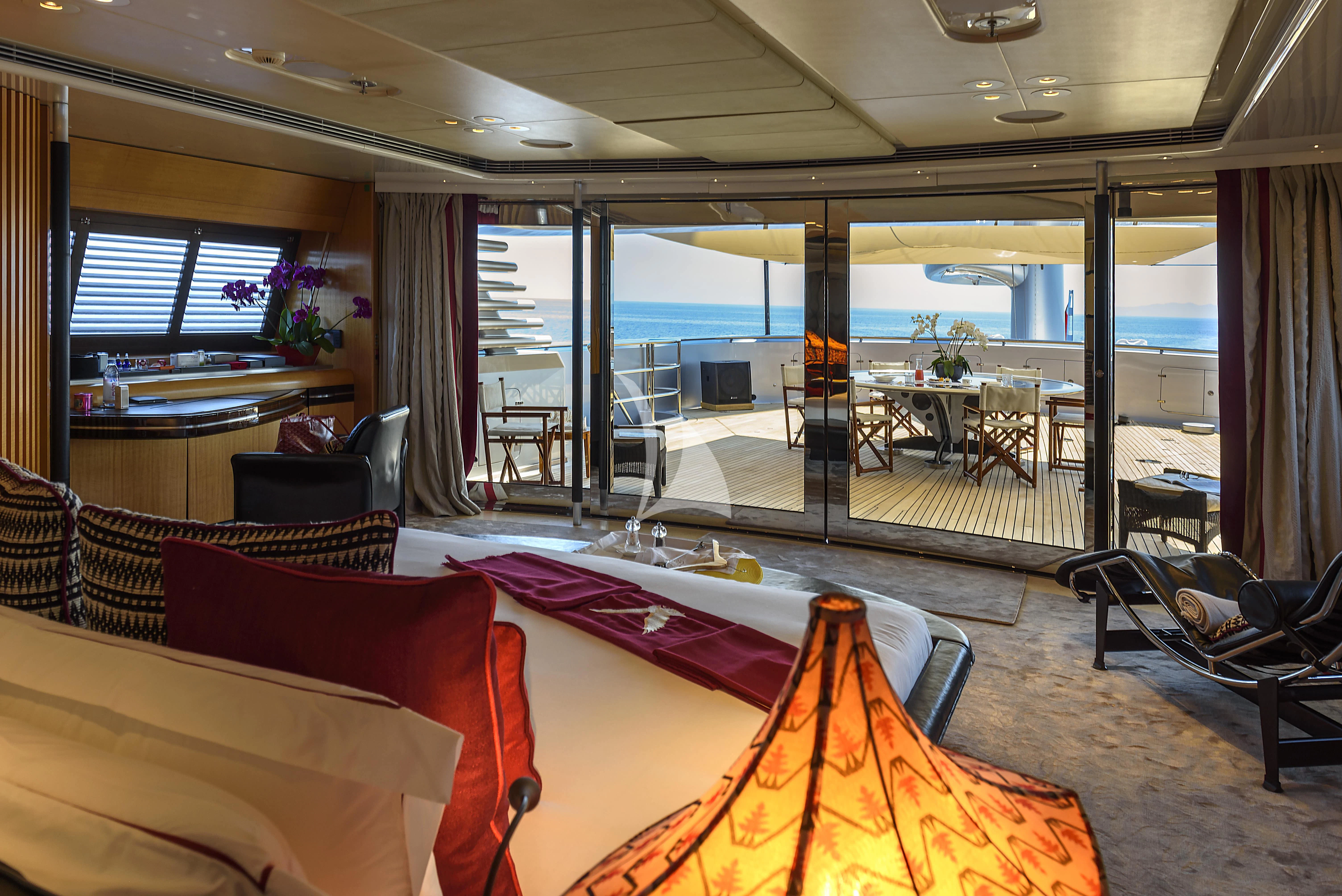 a living room with a large glass window aboard MALTESE FALCON Yacht for Sale