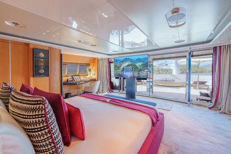 a room with a bed and a window aboard MALTESE FALCON Yacht for Sale