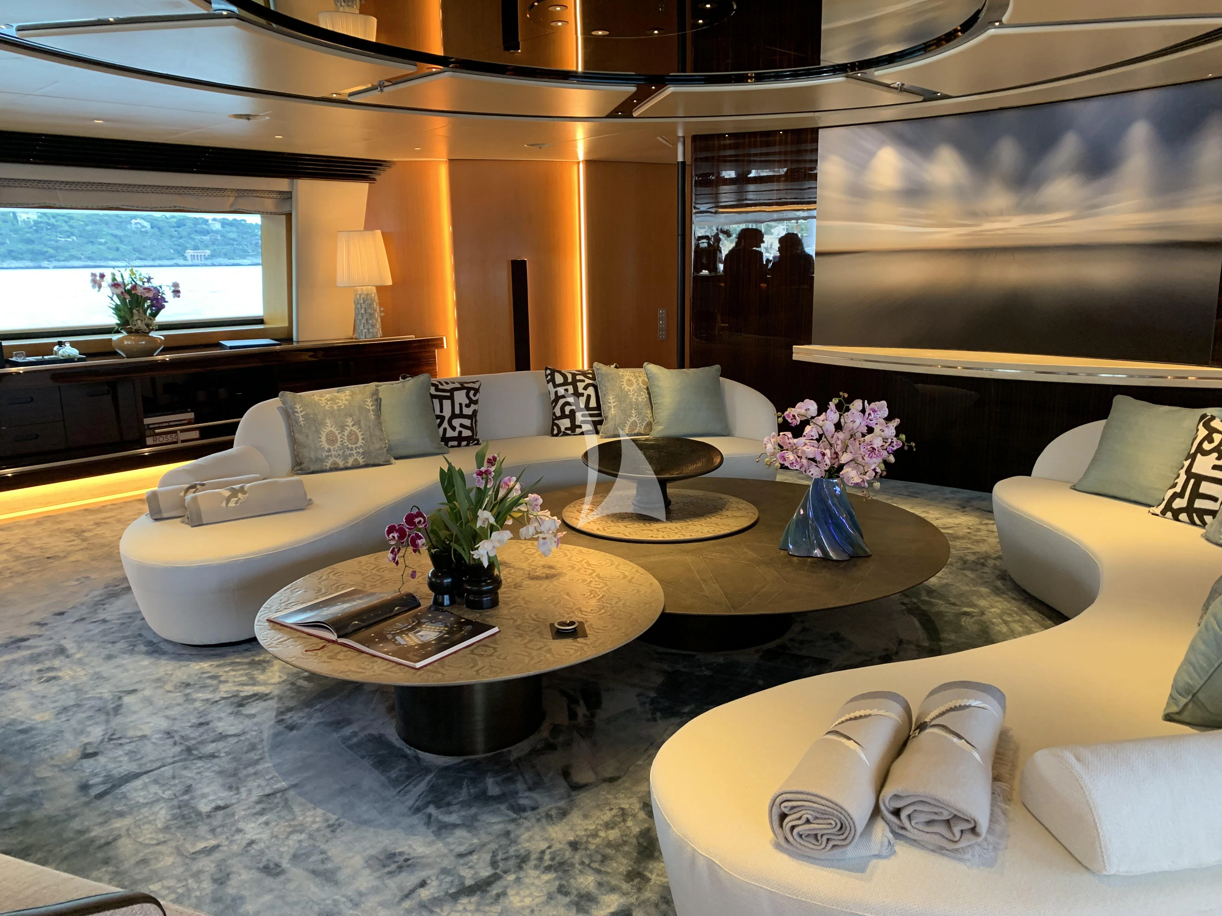 a room with a table and chairs aboard MALTESE FALCON Yacht for Sale