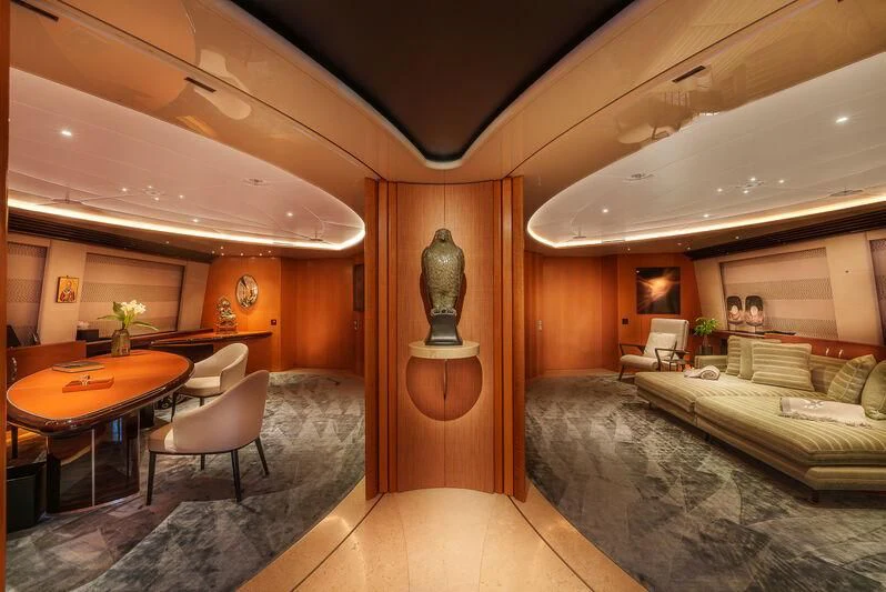 a room with a bed and a table aboard MALTESE FALCON Yacht for Sale